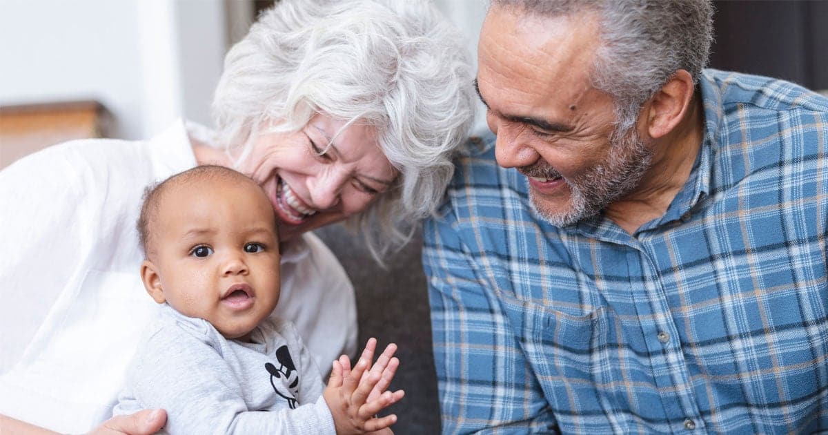 Do Grandparents Have Visitation Rights Maine portrayed by a grandmother, grandfather, and grand child all smiling.